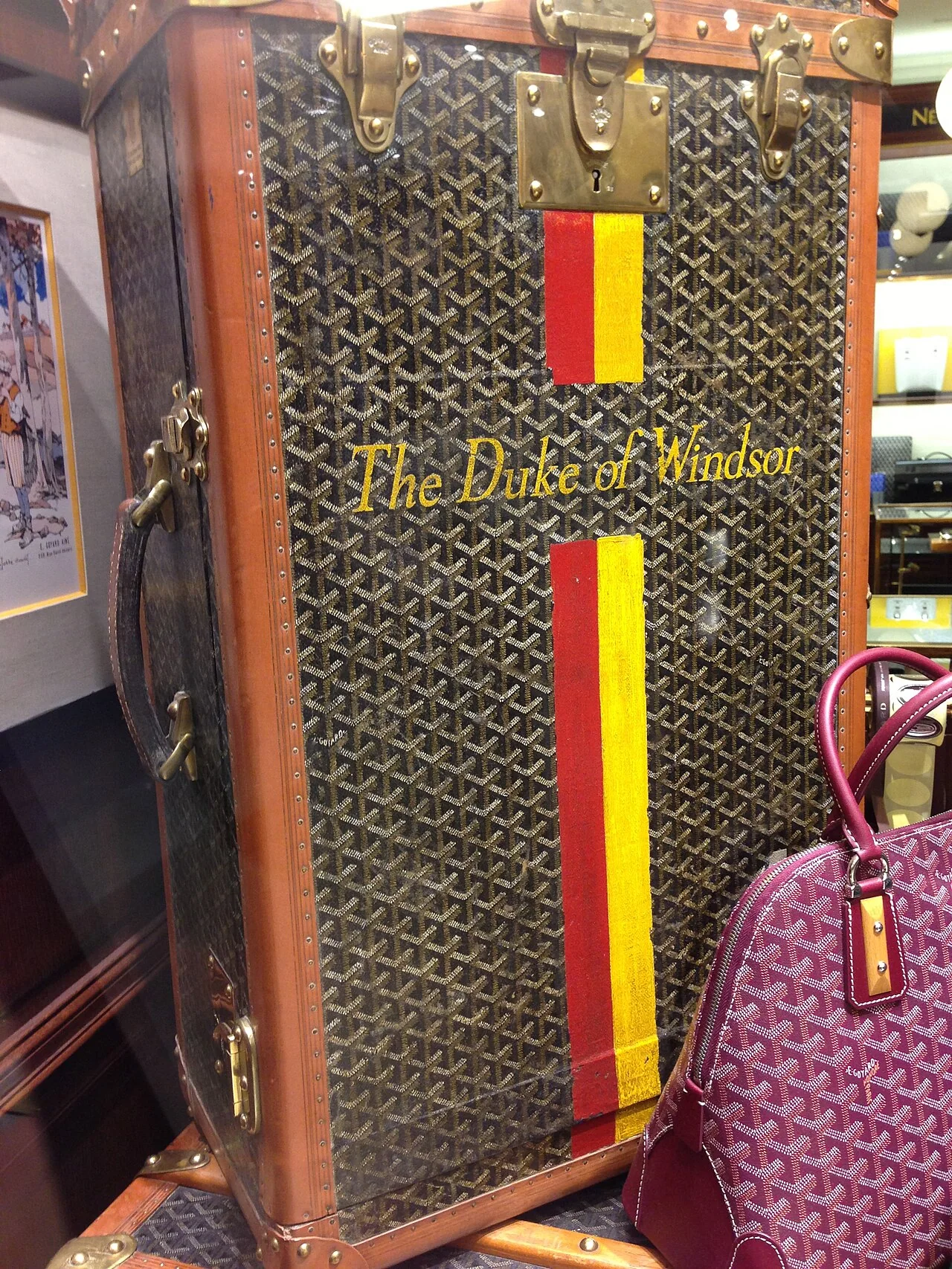Goyard trunk made for the Duke of Windsor, with a plum Goyard bag beside it
